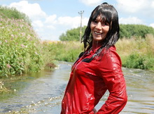 Dee in red jacket & trousers in the river